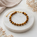 Bracelete Eira – Acabamento Dourado e Olho de Tigre A