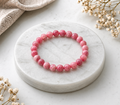 Rhodonit Kugelarmband auf Quarz 8mm AA+
